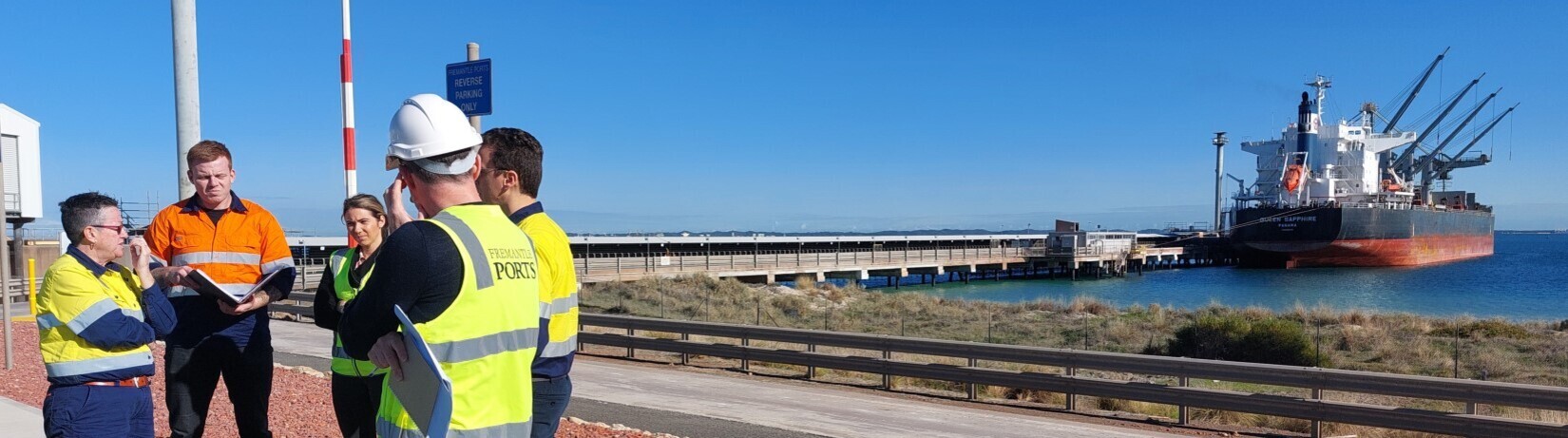 Photo of the jetty at Kwinana Bulk Terminal, with Westport staff and partners on site.