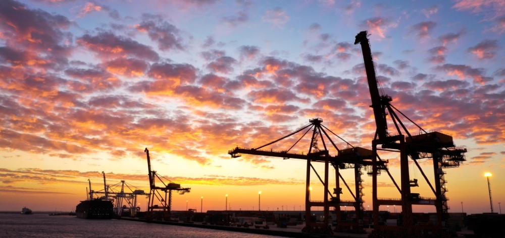 Ship-to-shore cranes at sunset Ship-to-shore cranes at sunset