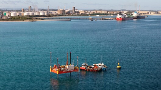 Aerial photo of marine geotechnical investigations being undertaken from a jack up barge and supporting vessels.